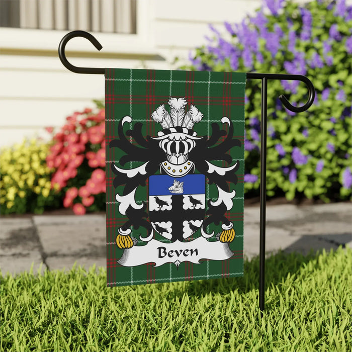 Beven family crest on a green plaid garden flag.