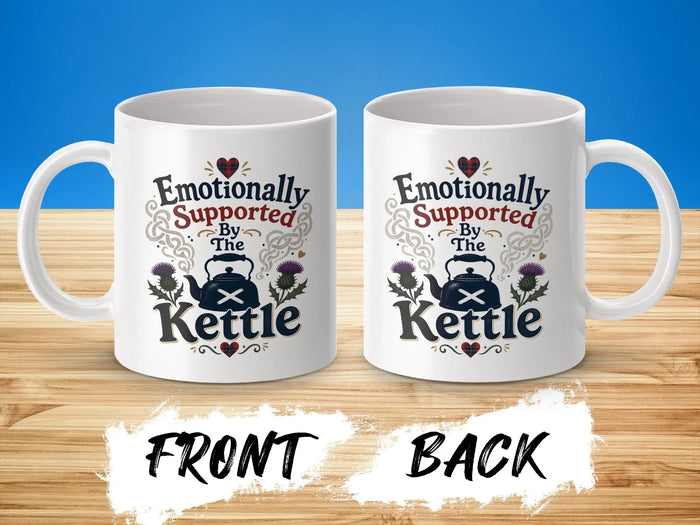 White mugs with "Emotionally Supported by The Kettle" and thistle design.