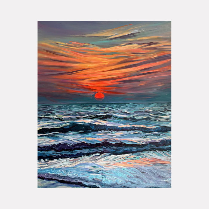 The artwork 'Goan Sunset' by Claudia Robles-Gil captures a dramatic seascape with turbulent waves in shades of deep blue and turquoise beneath a vibrant orange and coral sky. A large red sun descends on the horizon, casting warm reflections across the choppy ocean waters. The dynamic brushstrokes create movement in both sky and sea, painted in oil and acrylic on canvas.