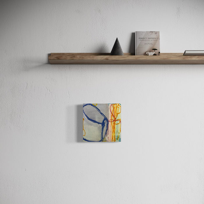 LS Series no. 21 by Janice La Motta features abstract minimalist composition with bold brushstrokes in blue and yellow. The artwork showcases organic curved forms against a light background, created with oil stick on Yupo paper. The 9x9 inch piece demonstrates gestural expressionism with dynamic linear elements.