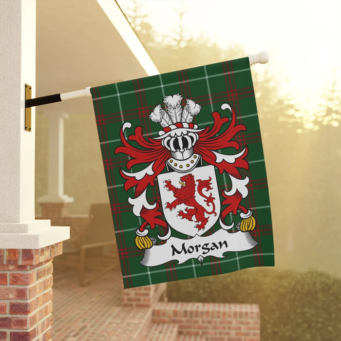 Morgan family crest on a green tartan flag, displayed outdoors.