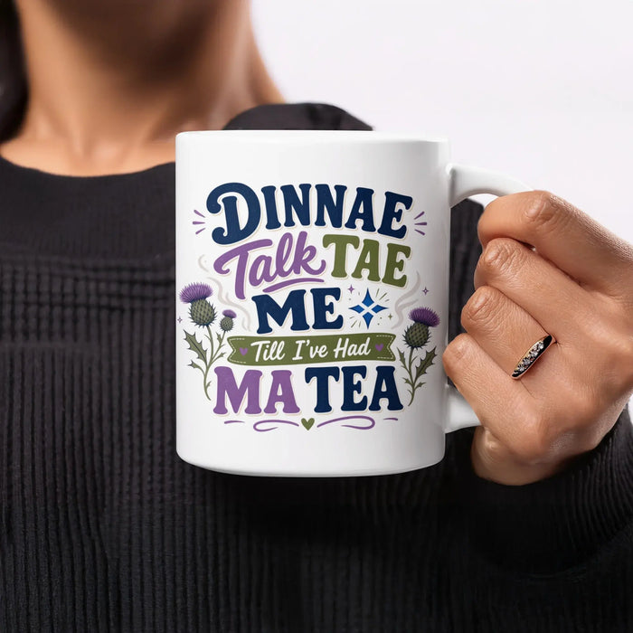 White mug with Scottish phrase "Dinnae talk tae me 'til I've had my tea".