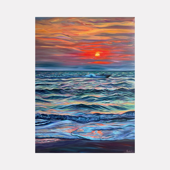 The artwork 'The Moment Is All There Is' by Claudia Robles-Gil depicts a vibrant seascape with rolling waves in shades of turquoise and deep blue beneath a dramatic sunset sky. Bold orange and red streaks paint the horizon, while a glowing sun disk reflects on the undulating ocean surface, creating a mesmerizing interplay of warm and cool tones through expressive brushstrokes in oil and acrylic on canvas.