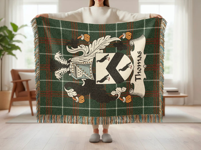 Green tartan blanket with Thomas family crest and surname.