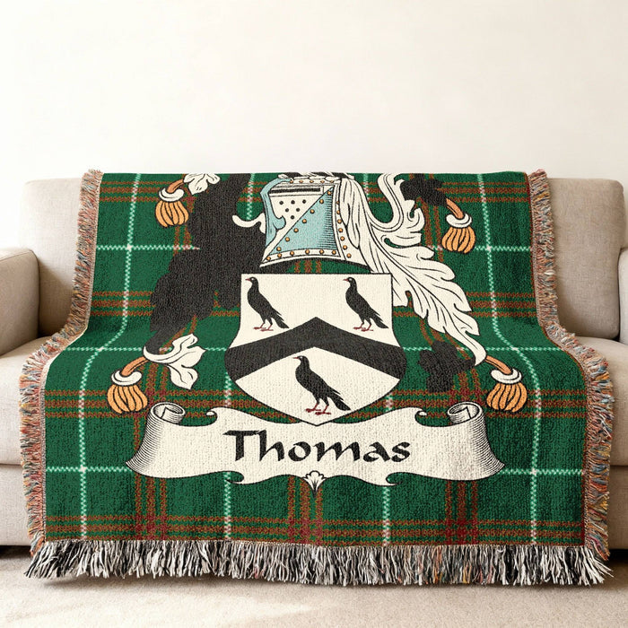Green tartan blanket with the Thomas family crest and name.