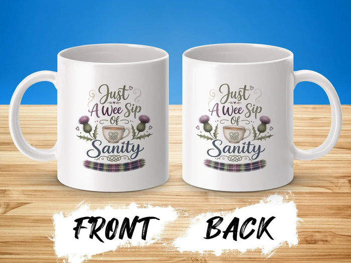 Two mugs, front and back views, with "Just A Wee Sip Of Sanity" text and thistle design.