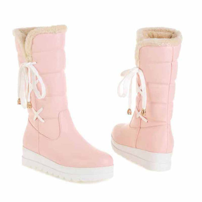 Stylish women's waterproof winter boots in pink with cozy fur lining and lace-up design