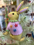 Yellow rabbit with pink dress